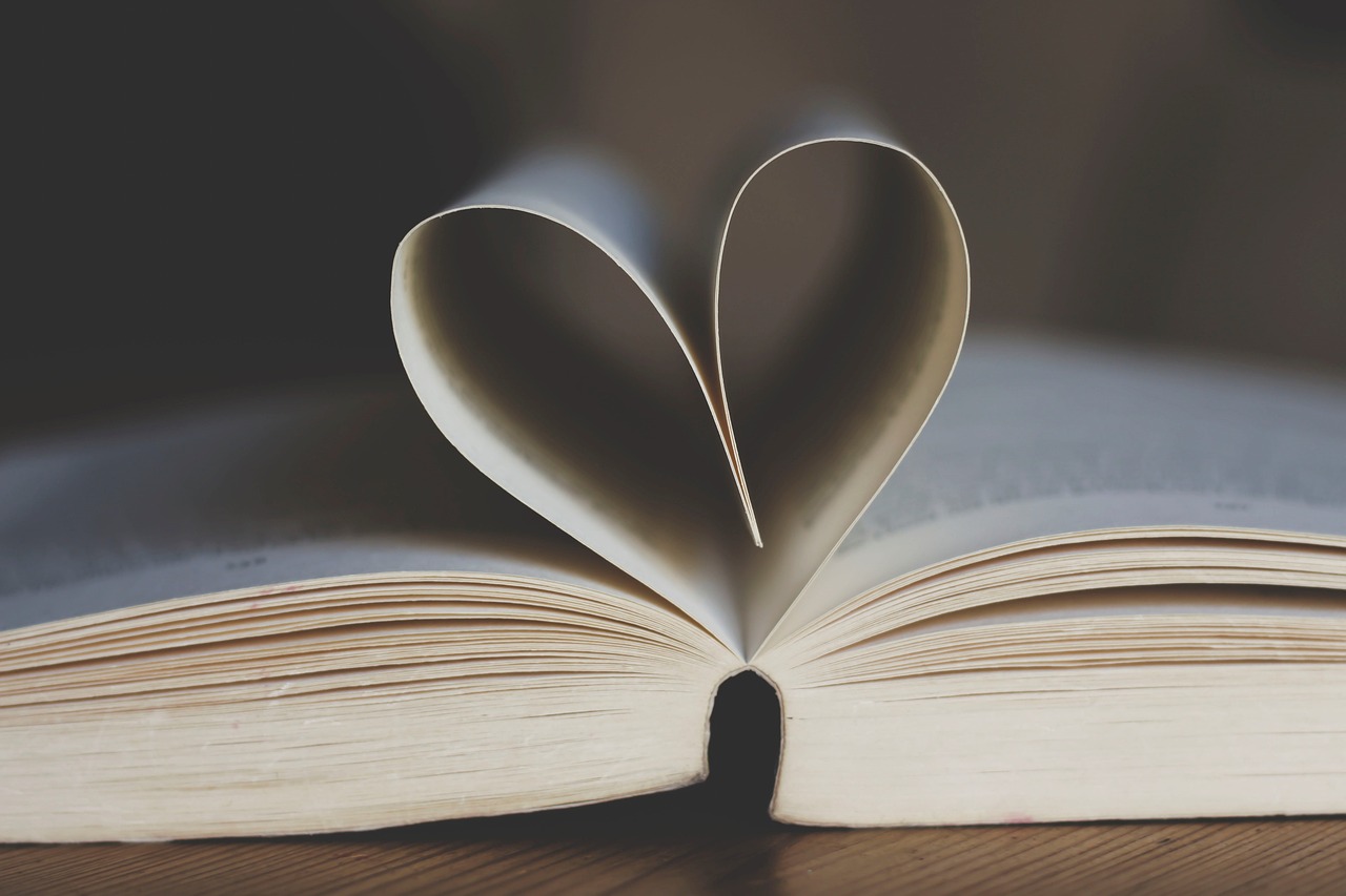 Pages of book in a heart shape to show how reading can help mental health.